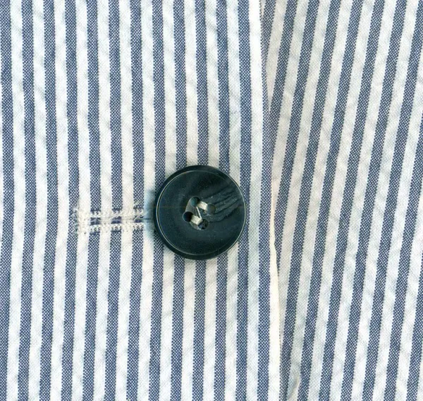 Seersucker with button.